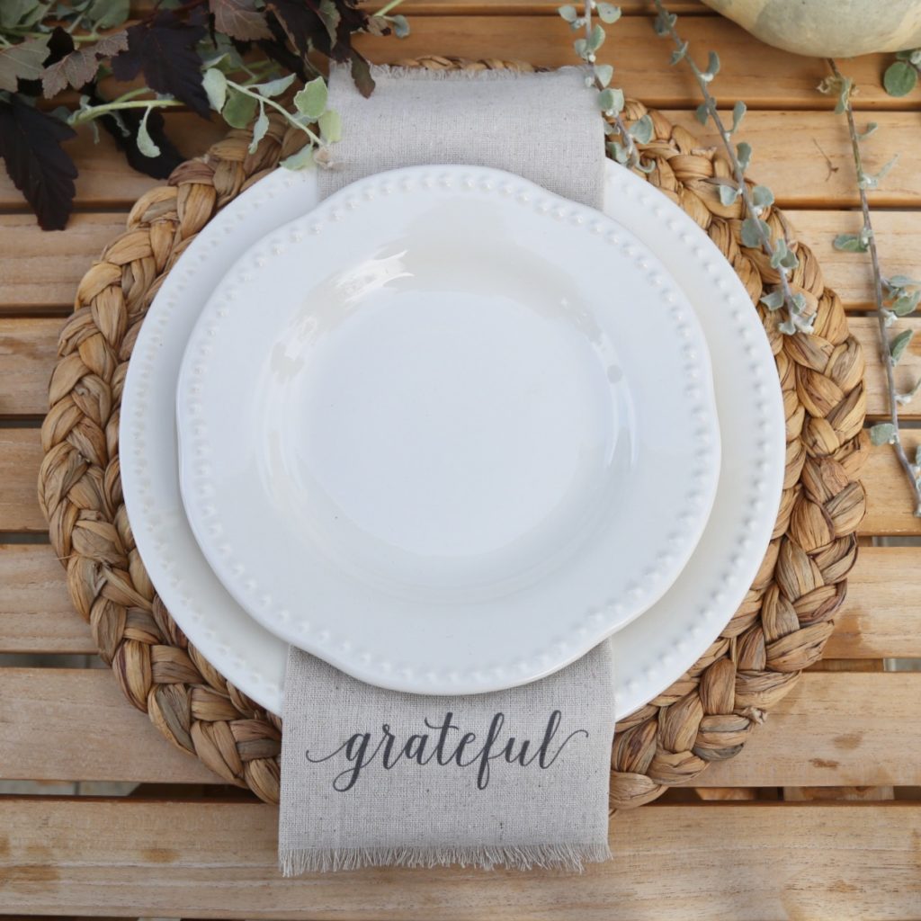 neutral-place-setting-white-dishes-napkin