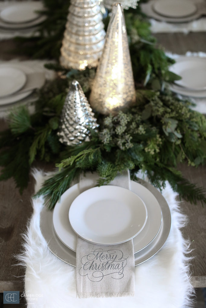 place setting for dinner, white plate,, white place mat, fresh greens